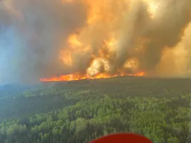As wildfires rage, an updated outlook shows the worst may be yet to come